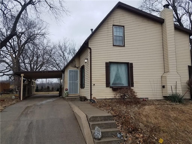 view of property exterior with a carport