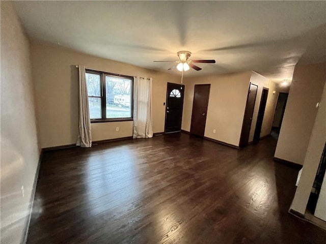 unfurnished room with dark hardwood / wood-style floors and ceiling fan