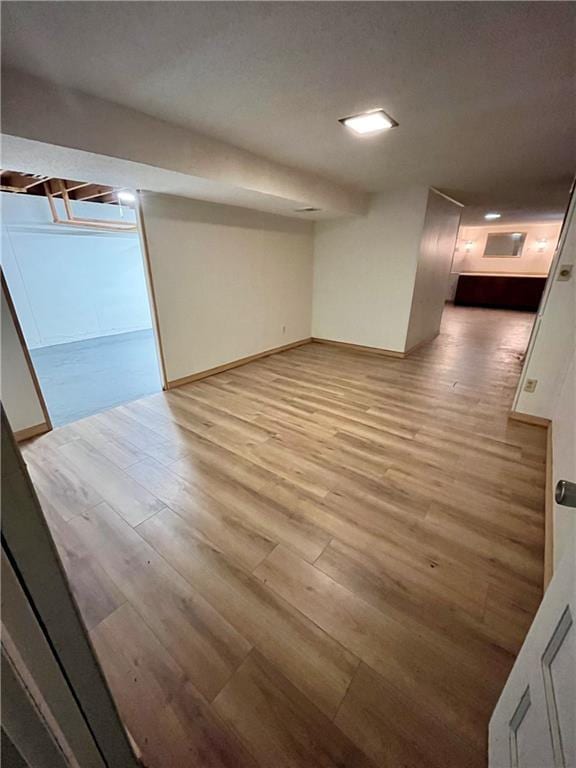 basement with light wood-type flooring