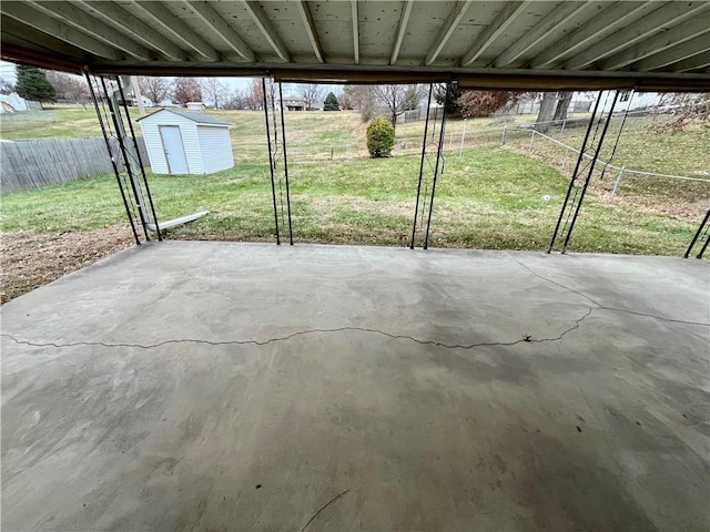 view of patio featuring a shed