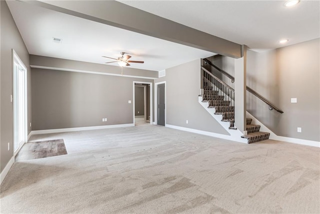 unfurnished living room with visible vents, recessed lighting, carpet flooring, baseboards, and stairs