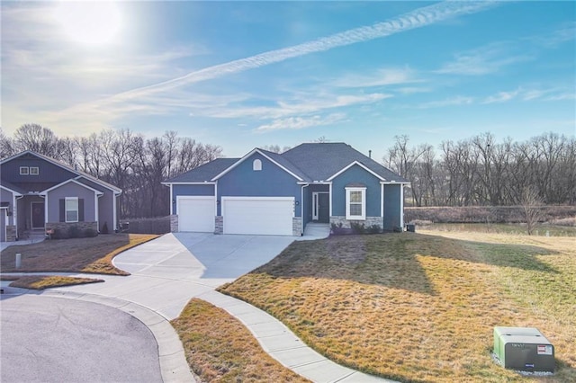 ranch-style home featuring a front yard, an attached garage, stucco siding, concrete driveway, and stone siding