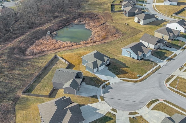 bird's eye view with a residential view and a water view