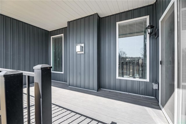 property entrance featuring board and batten siding