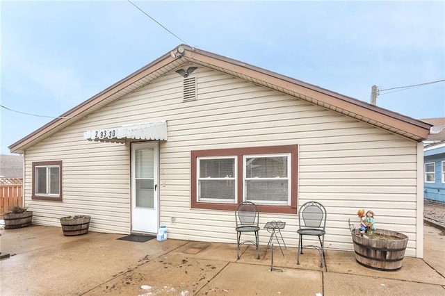 rear view of house featuring a patio