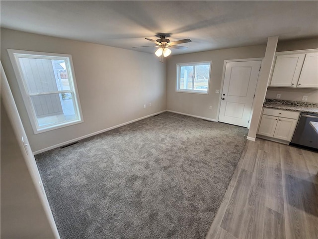 interior space featuring light wood-type flooring and ceiling fan