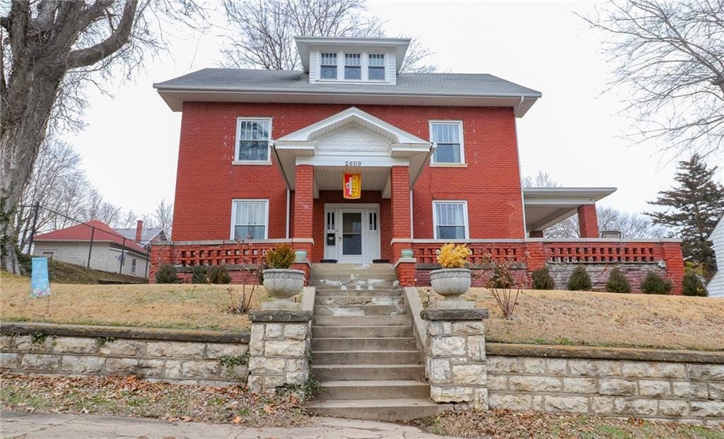 view of property featuring covered porch