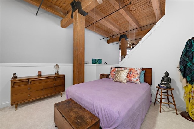 carpeted bedroom with beam ceiling, wooden ceiling, and baseboards