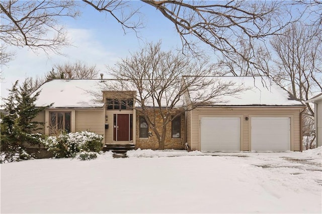 view of front of property with a garage