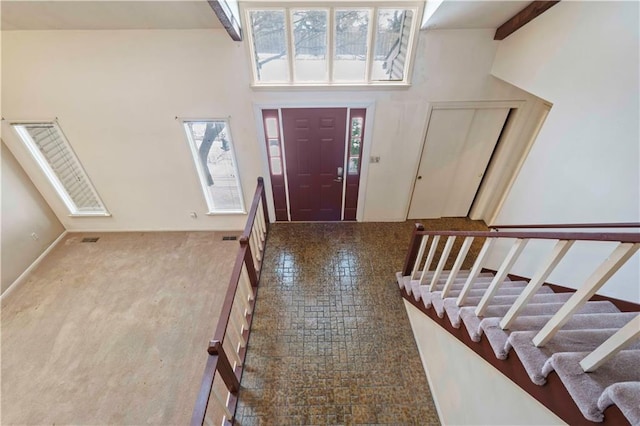 entryway with a towering ceiling