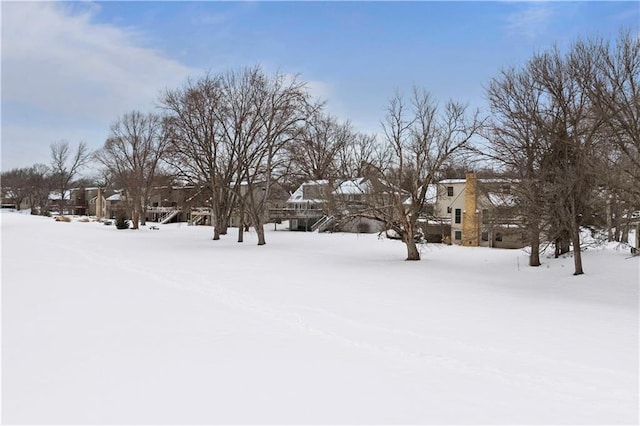 view of yard layered in snow