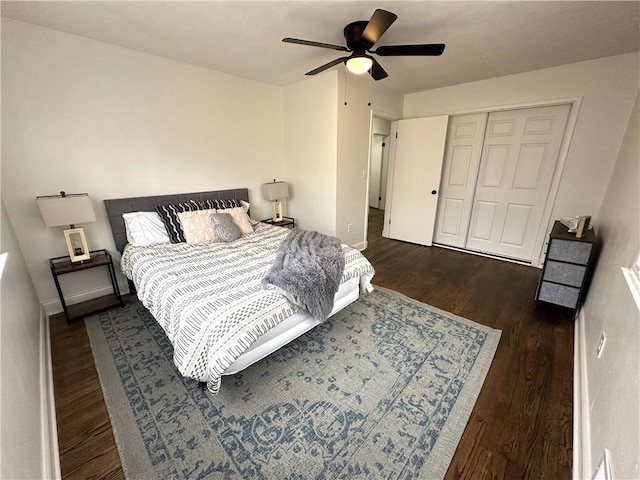 bedroom with ceiling fan, a closet, and dark hardwood / wood-style floors