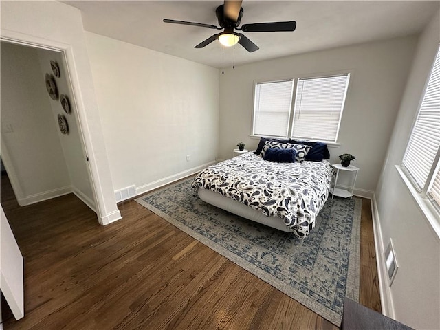 bedroom featuring ceiling fan and dark hardwood / wood-style flooring