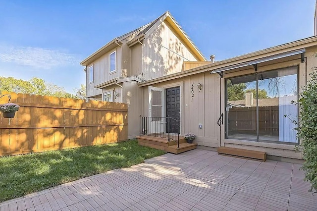 rear view of property with a wooden deck