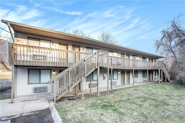 exterior space featuring a wooden deck and a yard