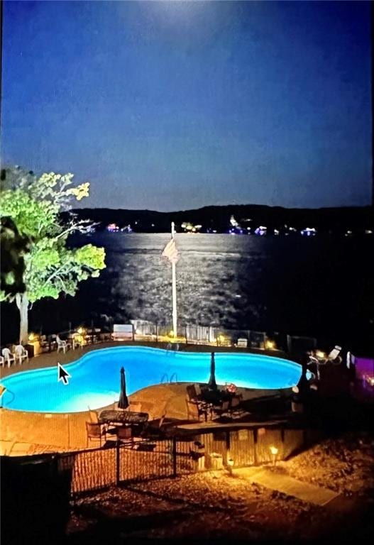 pool at night with a water view