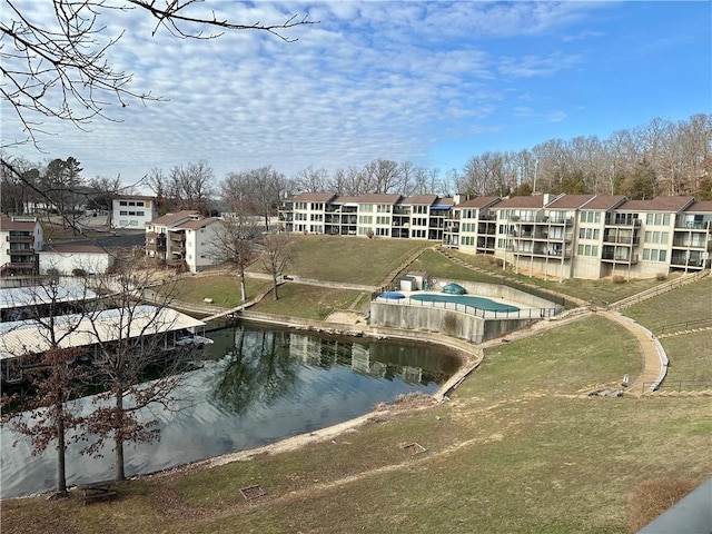 surrounding community with a water view