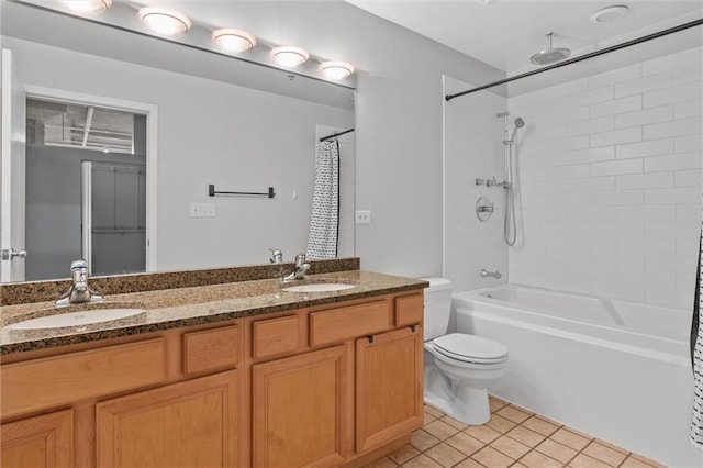 bathroom with tile patterned floors, vanity, and toilet