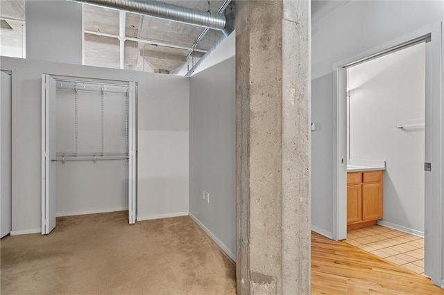 interior space featuring vanity and hardwood / wood-style flooring