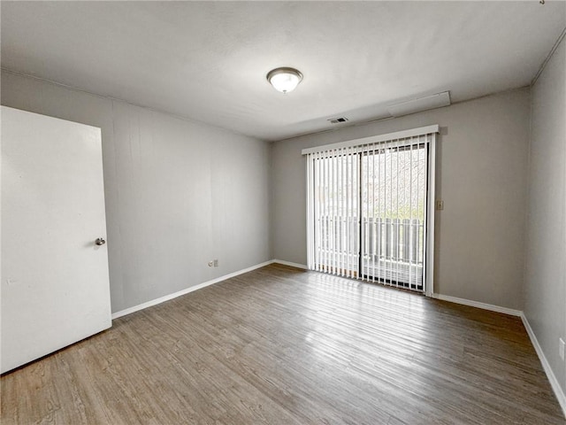 unfurnished room featuring wood-type flooring