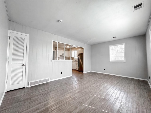 spare room featuring dark hardwood / wood-style flooring