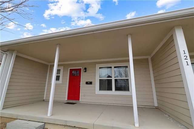 property entrance with covered porch