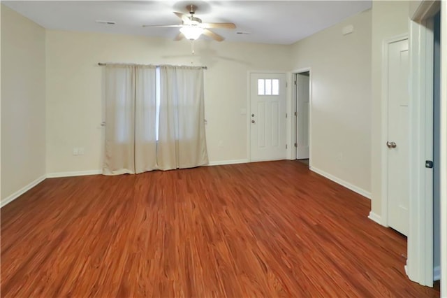 unfurnished room with hardwood / wood-style flooring and ceiling fan