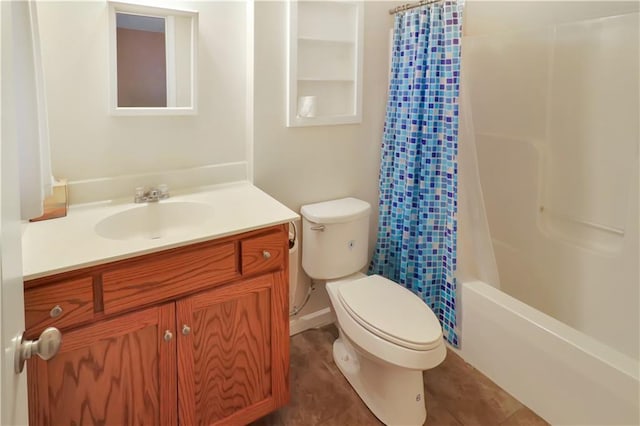 full bathroom with vanity, shower / bath combination with curtain, and toilet