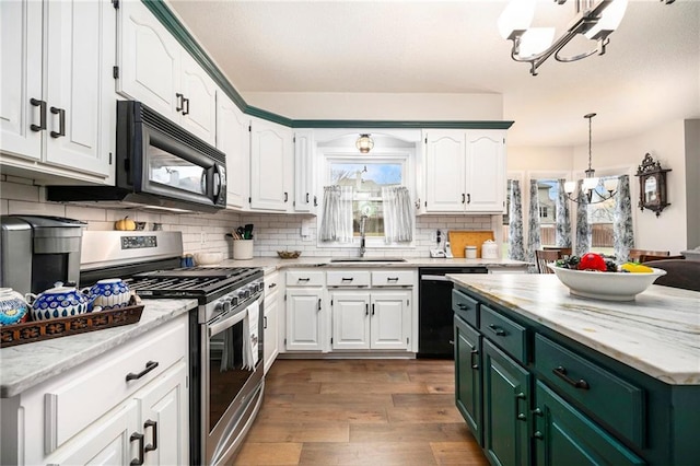 kitchen with white cabinetry, sink, black appliances, dark wood-type flooring, and an inviting chandelier