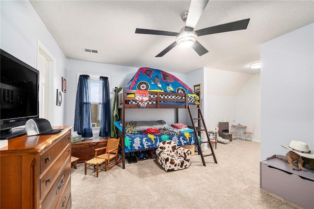 bedroom featuring ceiling fan and light carpet