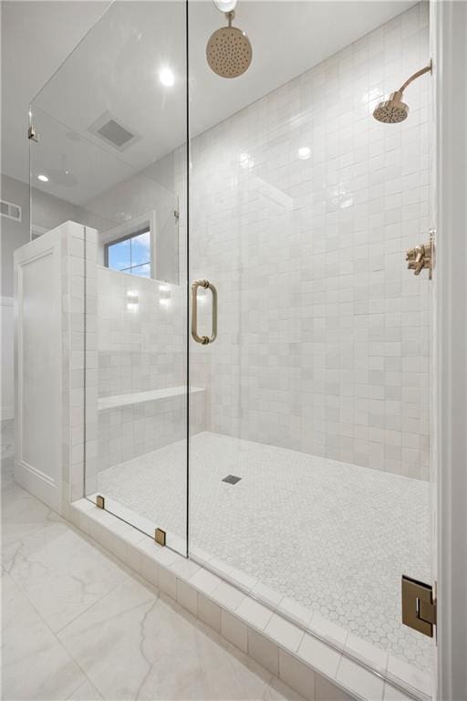 bathroom featuring a shower stall, visible vents, and marble finish floor