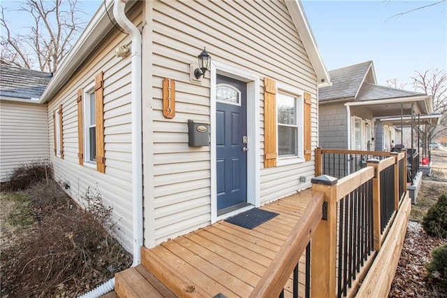 doorway to property featuring a wooden deck