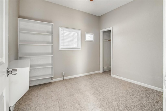 unfurnished bedroom with light colored carpet