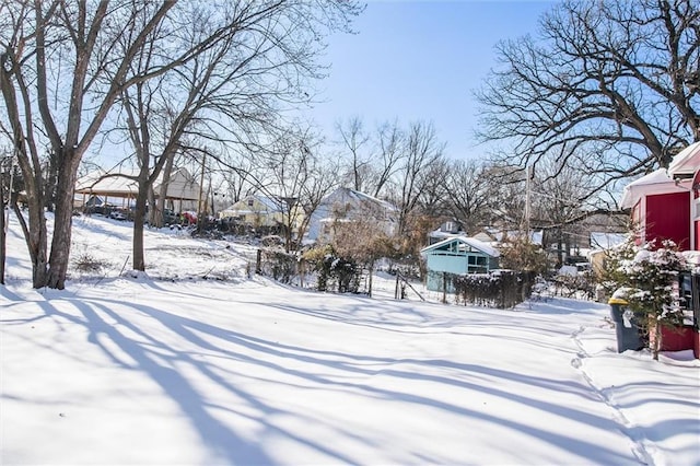 view of yard layered in snow