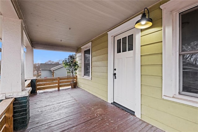 wooden terrace with a porch