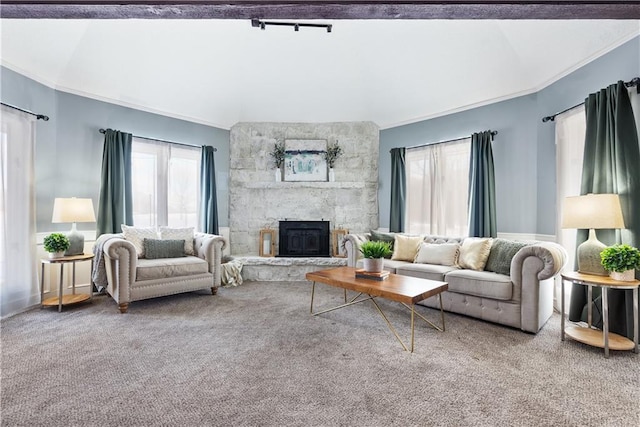 carpeted living room with a fireplace and ornamental molding