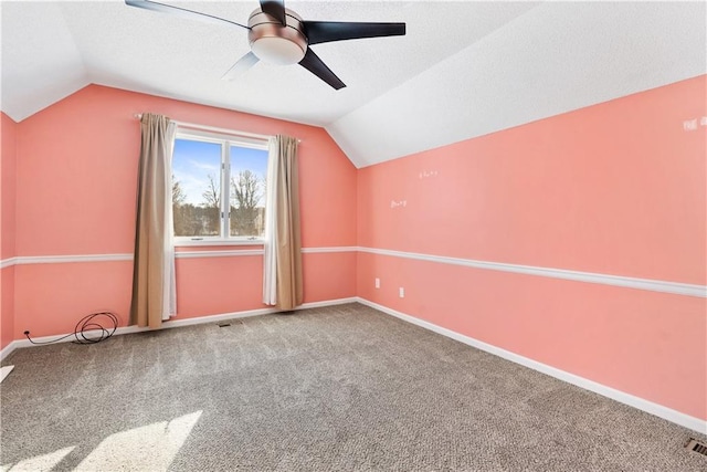 additional living space with carpet, vaulted ceiling, and ceiling fan