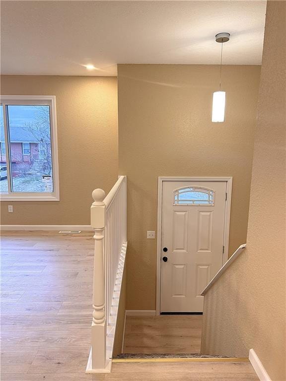 entrance foyer featuring light wood-type flooring