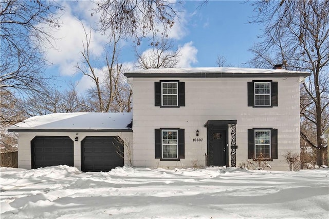 colonial inspired home with a garage