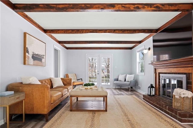 living room with hardwood / wood-style floors and a fireplace