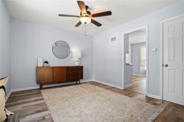 bedroom with ceiling fan and hardwood / wood-style floors