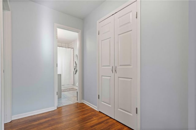 hall with dark hardwood / wood-style flooring