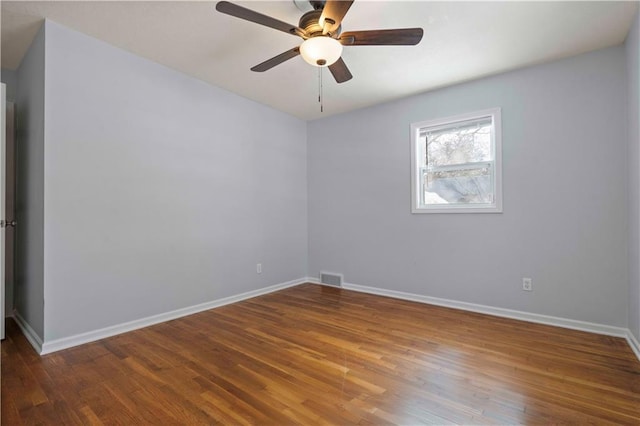 spare room featuring ceiling fan and hardwood / wood-style floors