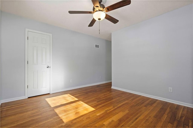 empty room featuring wood-type flooring and ceiling fan