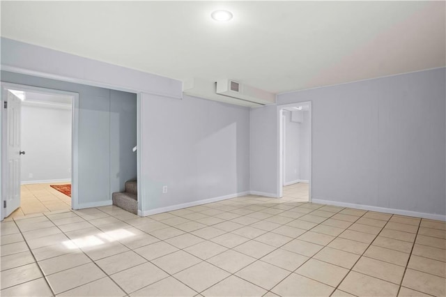 basement with light tile patterned flooring