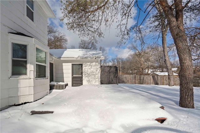 snowy yard with cooling unit