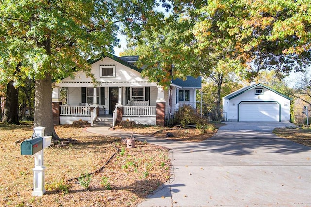 view of front of property with an outbuilding, a porch, and a garage