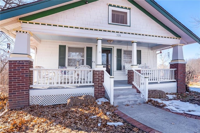 view of front of property featuring covered porch