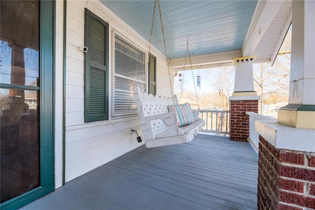 wooden terrace featuring a porch