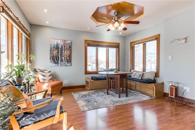 home office featuring wood-type flooring and ceiling fan